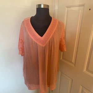 Light orange top.